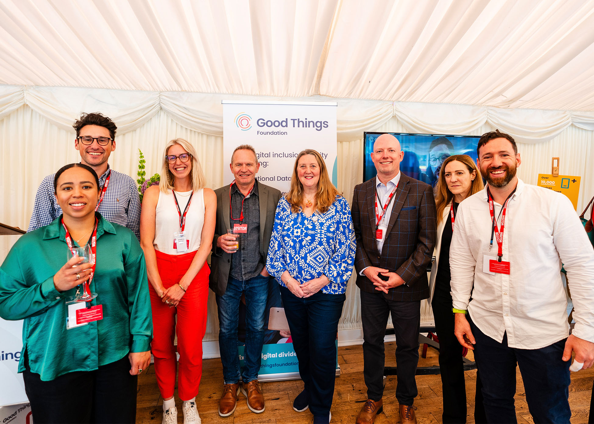 Helen Milner OBE, CEO of Good Things, standing with our strategic partners